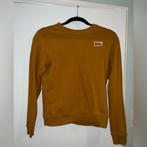 Fjallraven mustard yellow sweater.